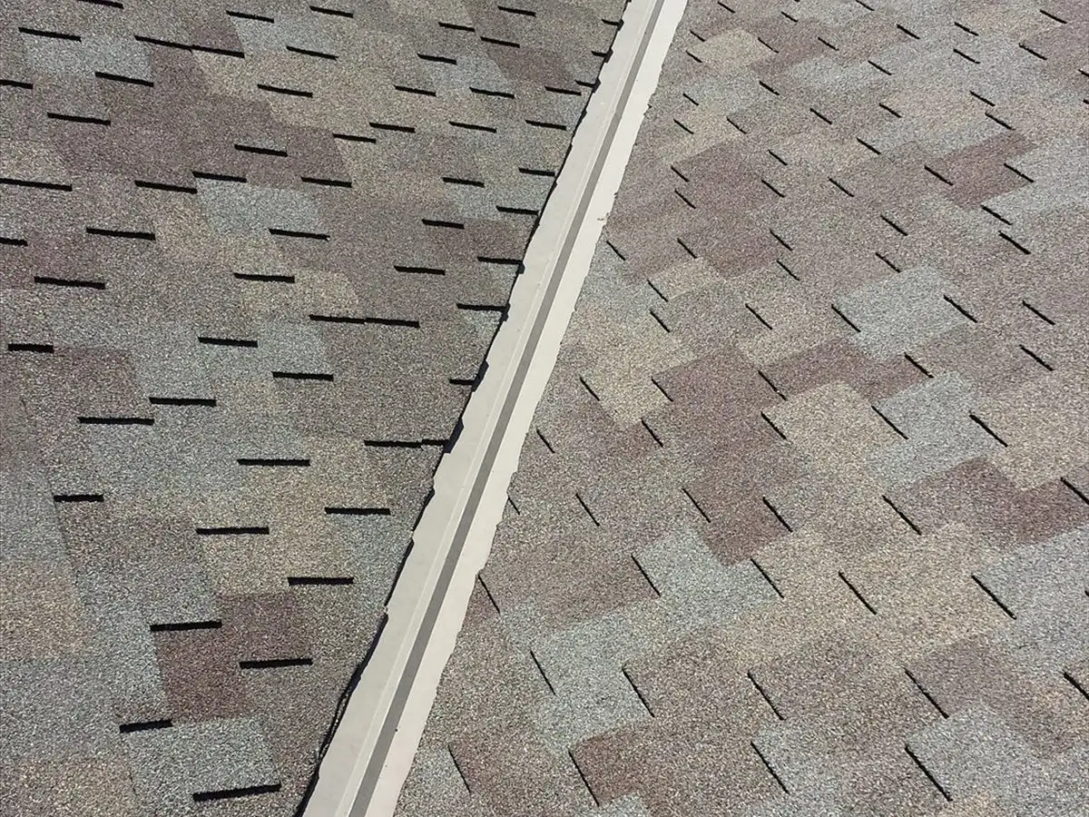 Metal valley flashing between two planes of CertainTeed Presidential shingles